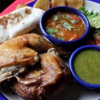 Pollo Al Carbon 1/2 · Marinated chicken broiled to juicy perfection. Served with Papas, Frijoles a la Charra, Guac...