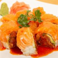 Texan Roll (Hot) / 德州卷 · Spicy tuna, avocado, and jalapeño. Topped with salmon, finished with spicy surf sauce.