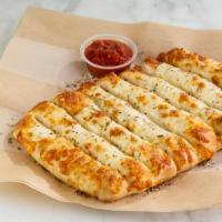 Cheesy Breadsticks · Served with organic red sauce or buttermilk ranch