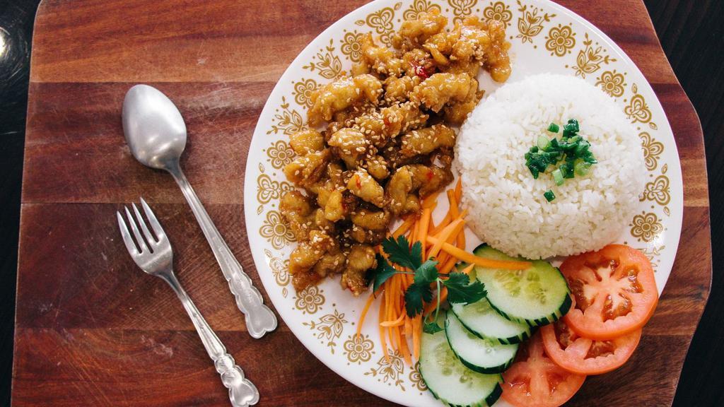 Sesame Chicken Rice Bowl / Cơm Gà Mè · With Sesame Sweet and Sour Sauce.