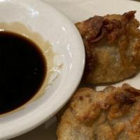 Fried Wontons (10) · 10 pcs. fried wontons deep-fried wontons stuffed with ground shrimp and served with our spec...