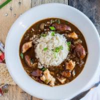 Gumbeaux & Salad Combo · Cup of our famous gumbo paired with a chopped salad.