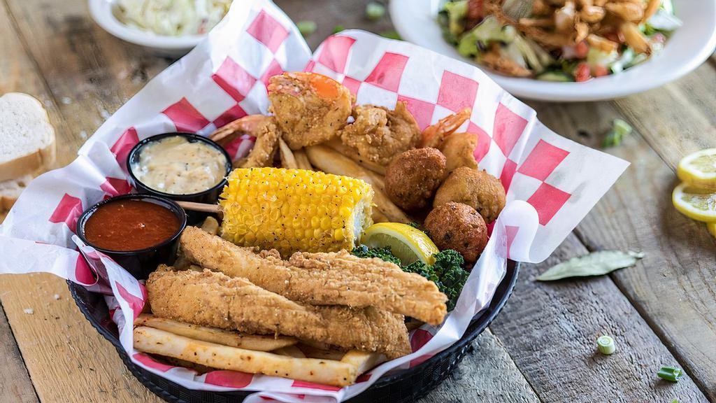 Shrimp And Catfish Combo · Two favorites hand battered, hand seasoned and perfectly fried. Served with Cajun seasoned fries, jalapeño hush puppies, and dipping sauces.