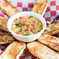 Cajun Fondue · Choice of shrimp, crawfish or chicken in a creamy cheese sauce, garlic toast.