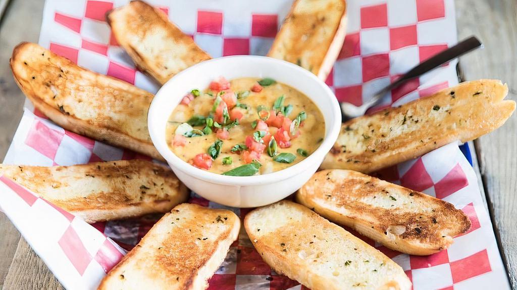 Cajun Fondue · Choice of shrimp, crawfish or chicken in a creamy cheese sauce, garlic toast.