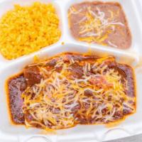 2 Enchiladas  · 2 enchiladas Flour top with  gravy  and cheese serve with  refried beans and rice