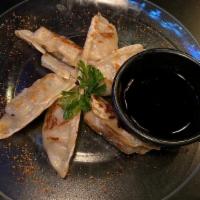 Gyoza · Pan-fried dumplings served with our house dipping sauce.