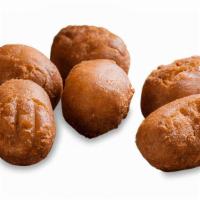 Kids' Mini Corn Dogs · Mini hot dogs wrapped in a honey batter, then fried. Served with choice of one side, or carr...