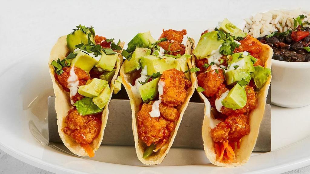 Honey Chipotle Shrimp Tacos · Corn tortillas, cilantro, shredded carrots & celery, ranch dressing, avocado with with your choice of one side. We recommend Cuban black beans & white rice