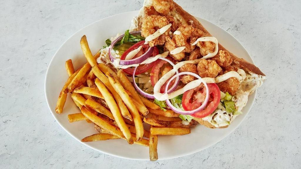 Shrimp Po'Boy · Creole mayo, lettuce, tomato, onions & pickles with your choice of side. We recommend Fries..