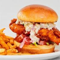 Nashville Hot Chicken Sandwich · Creamy slaw, pickled red onions, lettuce, tomatoes, pickles with your choice of side. We rec...