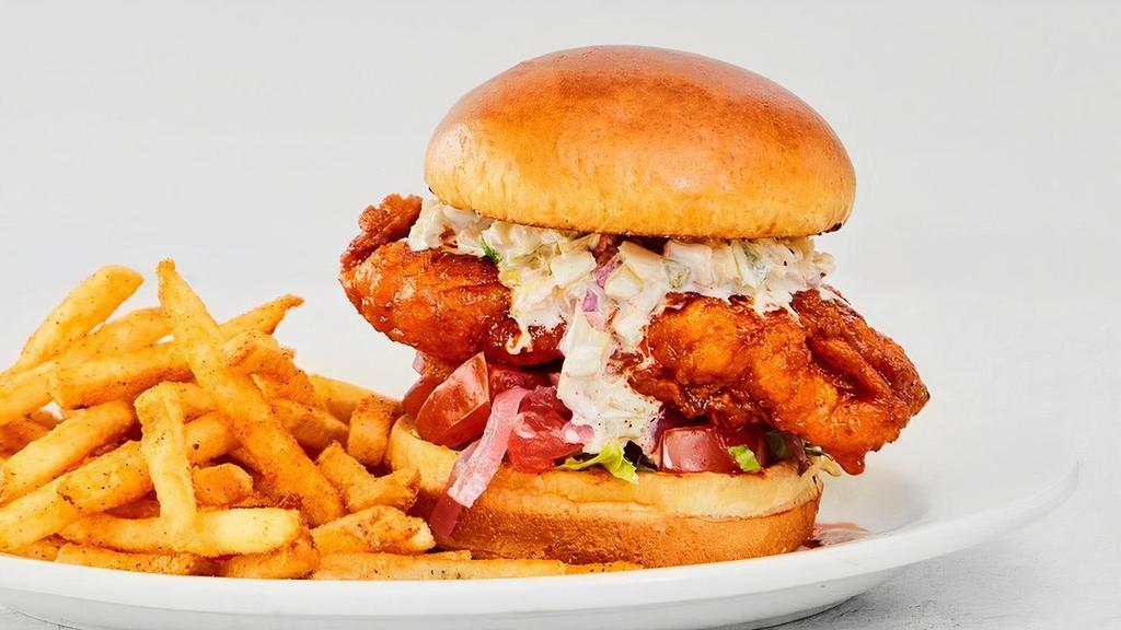 Nashville Hot Chicken Sandwich · Creamy slaw, pickled red onions, lettuce, tomatoes, pickles with your choice of side. We recommend Fries..