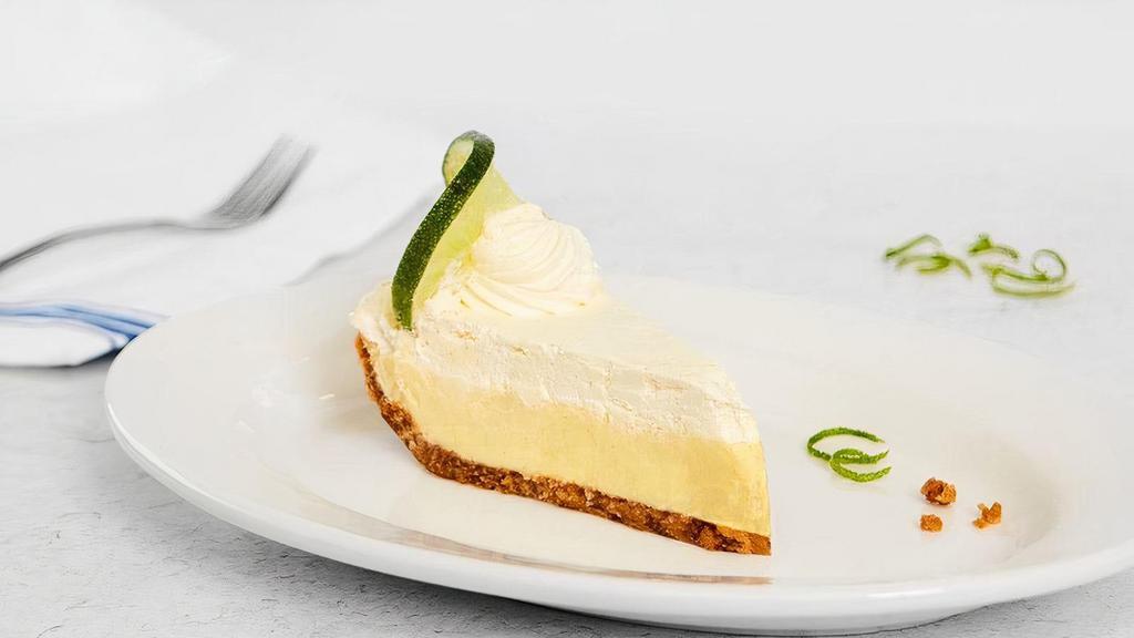 Key Lime Pie · A cool tangy lime custard with sweet whipped cream on top, traditional graham cracker crust