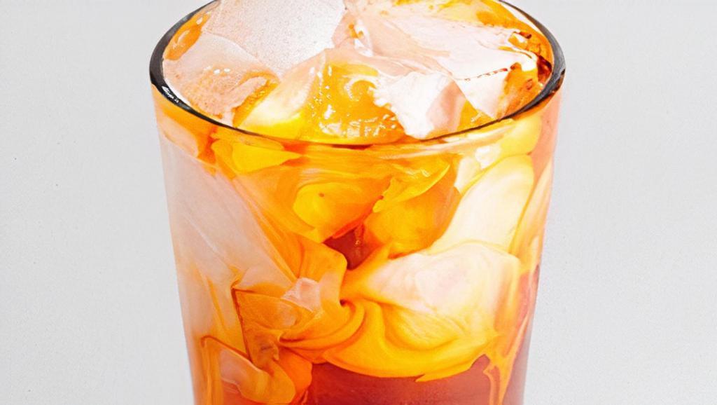 Thai Iced Tea · A blend of black tea, vanilla, and cinnamon poured over ice and topped with half and half.