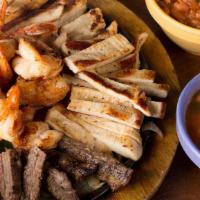 Parrillada Classic · Choose from Certified Angus Beef® or chicken fajitas, shrimp, or carnitas. Served with guaca...