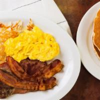 Hot Pancake Plate With 2 Buttermilk Pancakes · 2 eggs cook to order. 4 oz. slice ham, 2 sausage patties, 2 slices bacon, hash browns and si...