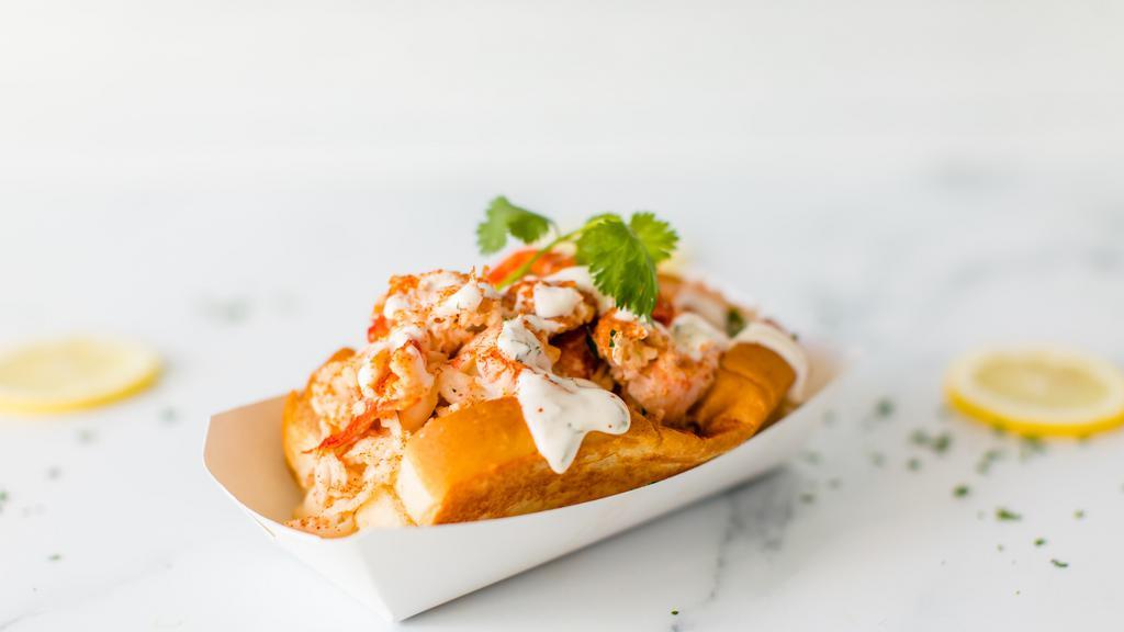 Lobster Grinder · Lobster, Langostino Lobster Tails,  Claw and Knuckle Meat, Mayo, Seasoning, Fresh Herbs, Chives, Lemon, House Sauce drizzle, Butter and Roll._x000D_
_x000D_
Note: This item is already tossed in Light Mayo. TY.