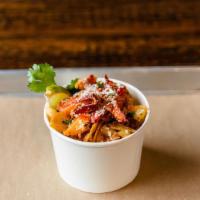 Lobster Mac · Cavatappi pasta, Creamy gouda cheese, Bacon, Crumbled Chips, Lobster, Cotija Cheese, Chives,...