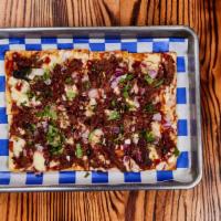 The Texan Flatbread · Smoked Brisket or Chik’n · Jack Cheese · BBQ Sauce · Red Onions ·  Cilantro