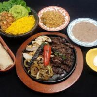 1/2 Lb Beef & Chicken · Lime pepper marinated grilled beef and chicken fajitas. Served with your choice of tortillas.