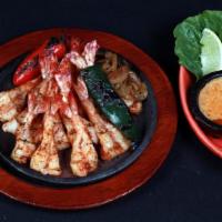 1 Lb Shrimp · Lime pepper marinated grilled shrimp fajitas. Served with your choice of tortillas.