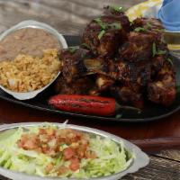 Regular Chipotle Smoked Ribs · 9 Slow roasted baby back ribs, basted with our spicy chipotle BBQ sauce. Served with Mexican...