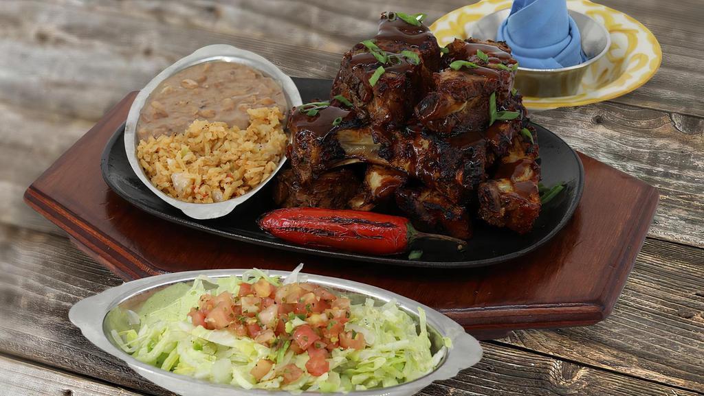 Regular Chipotle Smoked Ribs · 9 Slow roasted baby back ribs, basted with our spicy chipotle BBQ sauce. Served with Mexican salad.