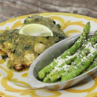 Chicken Flaca · Marinated grilled chicken breasts, spinach, artichoke, green tomatillo sauce with seasonal v...