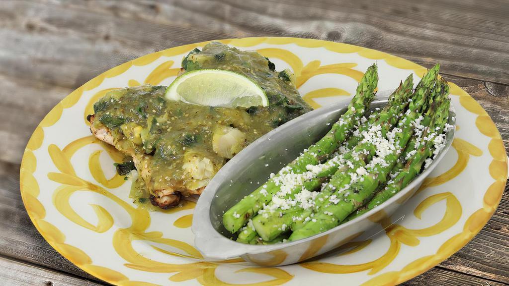 Chicken Flaca · 2 Marinated grilled chicken breasts, spinach, artichoke, green tomatillo sauce with seasonal vegetables