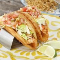Lobster Tacos · 7 oz diced, grilled lobster tail, lime pepper butter, iceburg lettuce & pico de gallo on cri...