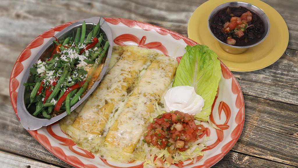 Green Cheese Enchiladas · Corn tortillas filled with jack cheese & topped with a green tomatillo sauce. Served with black beans & a seasonal vegetable.