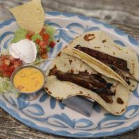 Mushroom Tacos Al Carbon · Homemade corn tortillas filled with grilled portobello mushrooms. Served with guacamole, pic...