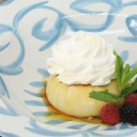 Flan · Traditional Mexican caramel custard with caramel sauce, whipped cream and seasonal berries.