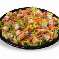 Crispy Chicken Salad · Our signature chicken strips, served hot and crispy, diced, and placed on a crisp blend of r...