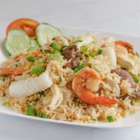 Combination Fried Rice · Chicken, beef, shrimp, peas, carrots, onion, egg.