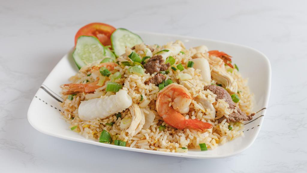 Combination Fried Rice · Chicken, beef, shrimp, peas, carrots, onion, egg.