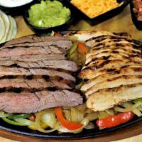 Parrillada Para 1 Combo · Combination of beef and chicken with rice, beans, onions, guacamole and  pico de gallo, with...