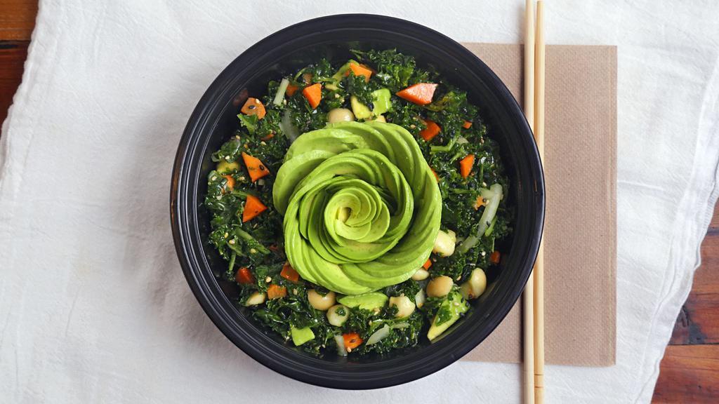 Asian Kale Salad · A delicious fresh salad! Massaged kale tossed with avocado, carrots, mac nuts, white and green onion, shoyu vinaigrette, sesame seeds.