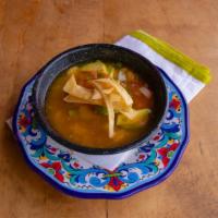 Tortilla Soup · Homemade chicken broth with roasted chicken, rice, diced avocado, pico de gallo, and tortill...