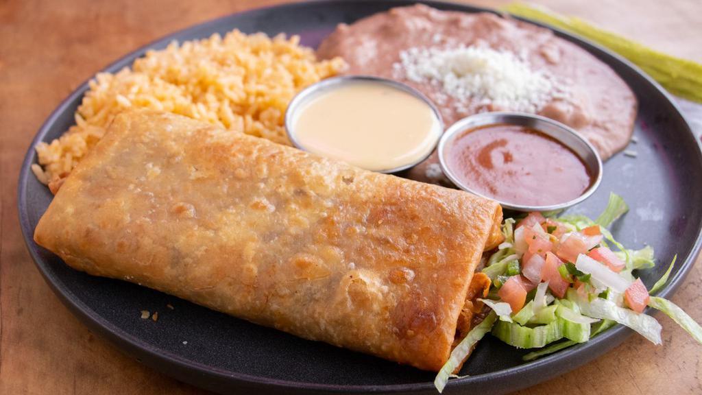 Chimichangas · A flour tortilla stuffed with refried beans, cheese and your choice of beef or chicken, then deep fried and topped with chile.