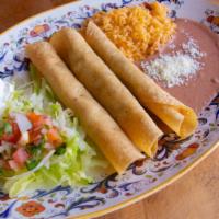 Flautas · 3 hand rolled tortilla stuffed with shredded chicken served with rice and beans.