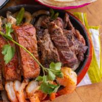 Parrilladas Completas · Beef, chicken, shrimp, and pork ribs.