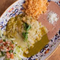 Enchiladas Verdes · 3 hand rolled tortilla stuffed with chicken topped with green salsa and cheese.