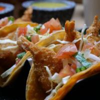 Baja Fish And Shrimp Tacos · 3 pieces. A touch of homemade cilantro sauce fish or shrimp, topped with cabbage and pico de...