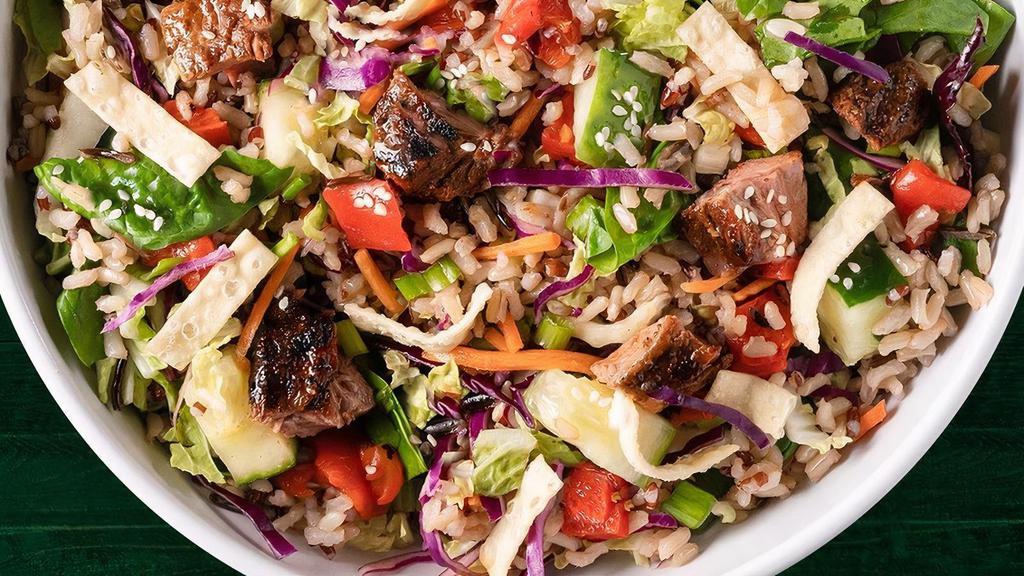 Korean Bbq · Wild Rice Blend, Spinach, Red & Napa Cabbage, Carrots, Roasted Red Peppers, Cucumbers, Green Onions, Radishes, Crispy Wontons, Sesame Seeds, Sweet Soy Grilled Tenderloin with Sesame Gochujang Dressing