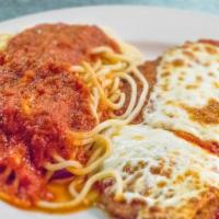 Chicken Parmigiana · Breaded chicken breast topped with mozzarella and homemade marinara sauce, served with fresh...