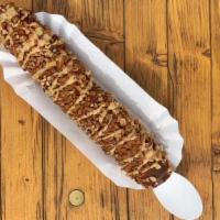 Texas Two-Step · A frozen banana, dipped in melted chocolate, rolled in toffee and pecans, sprinkled with cin...