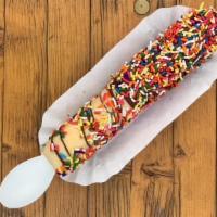 Milly Vanilly · A frozen banana dipped in vanilla, half dipped in chocolate. Your choice of topping! Thanks ...