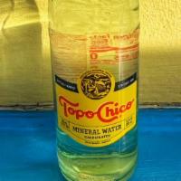 Topo Chico · Cold 12oz bottled mineral water