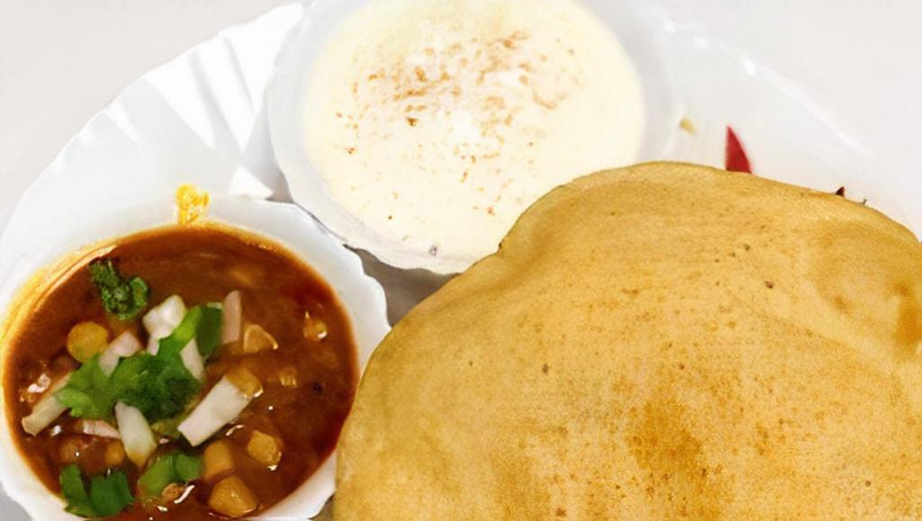 Channa Bhatura · Two fluffy, deep fried flat breads served with chickpeas and yogurt.
